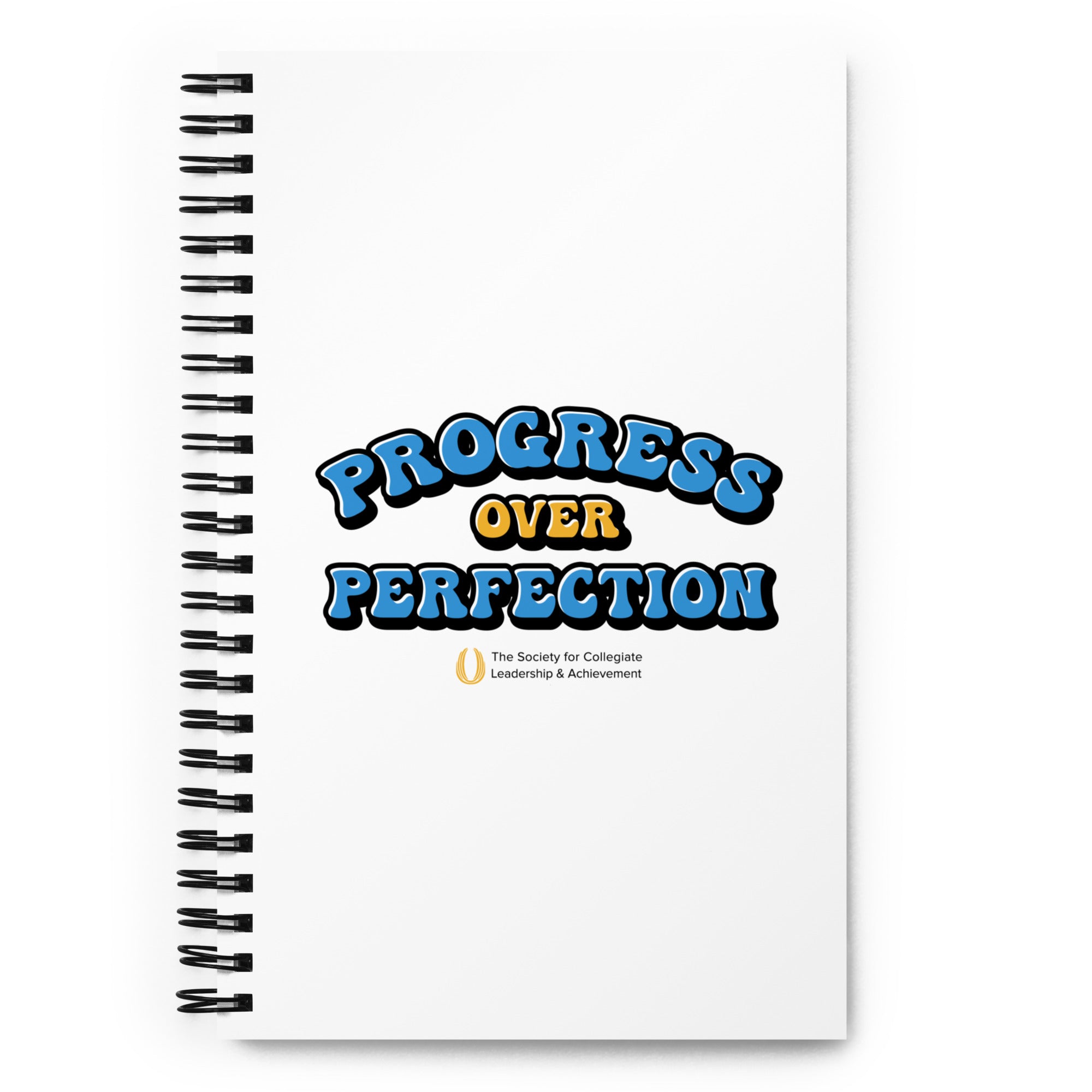 Notebook with 'Progress Over Perfection' text on a white background