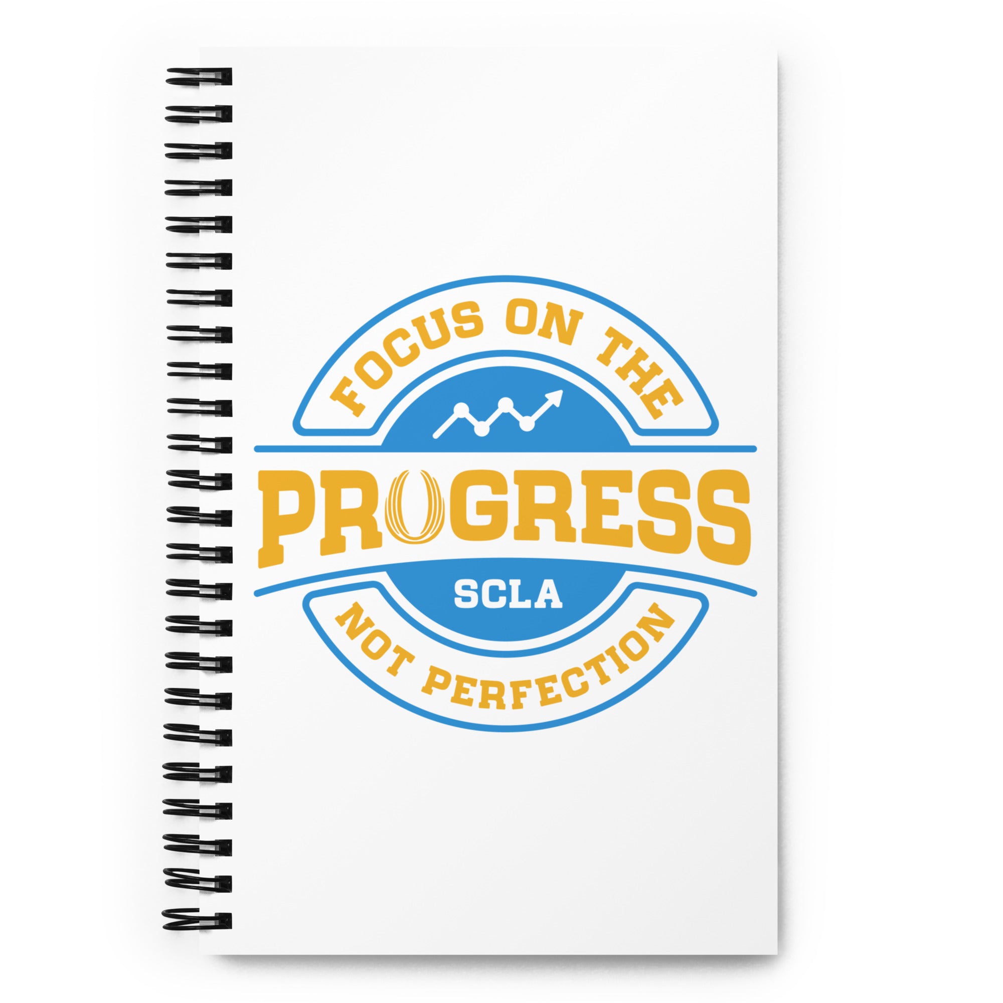 Notebook with 'Focus on the Progress, Not Perfection' design on a white background