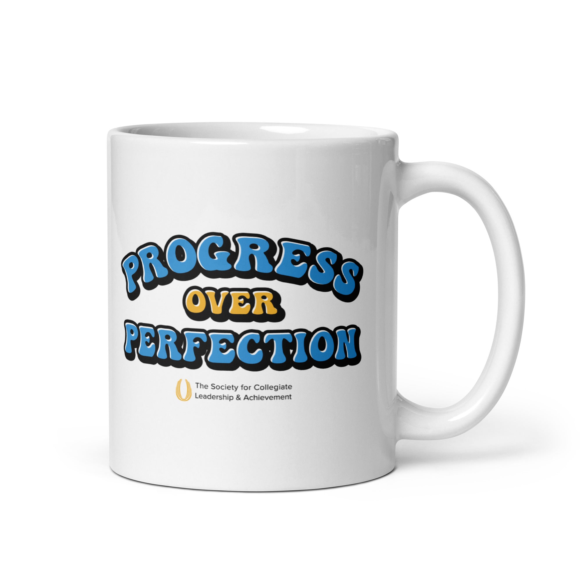 White mug with 'Progress Over Perfection' text on a white background